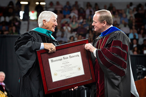 George H. Bishop, left, receives an honorary Doctor of Public Service degree from MSU President Mark E. Keenum during Friday [May 3] morning commencement ceremonies at Mississippi State University. The Smith County native is a 1958 MSU petroleum geology graduate who in 1981 founded GeoSouthern Energy, which grew to become one of the largest, privately held producers of oil and gas in the country. (Photo by Megan Bean)