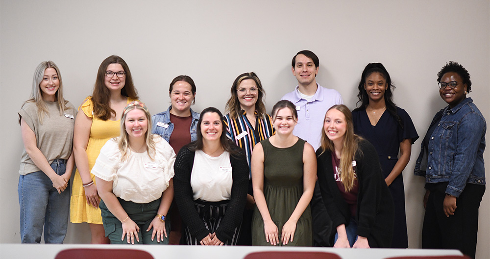 A group picture of two rows of MSU school psychology graduate students