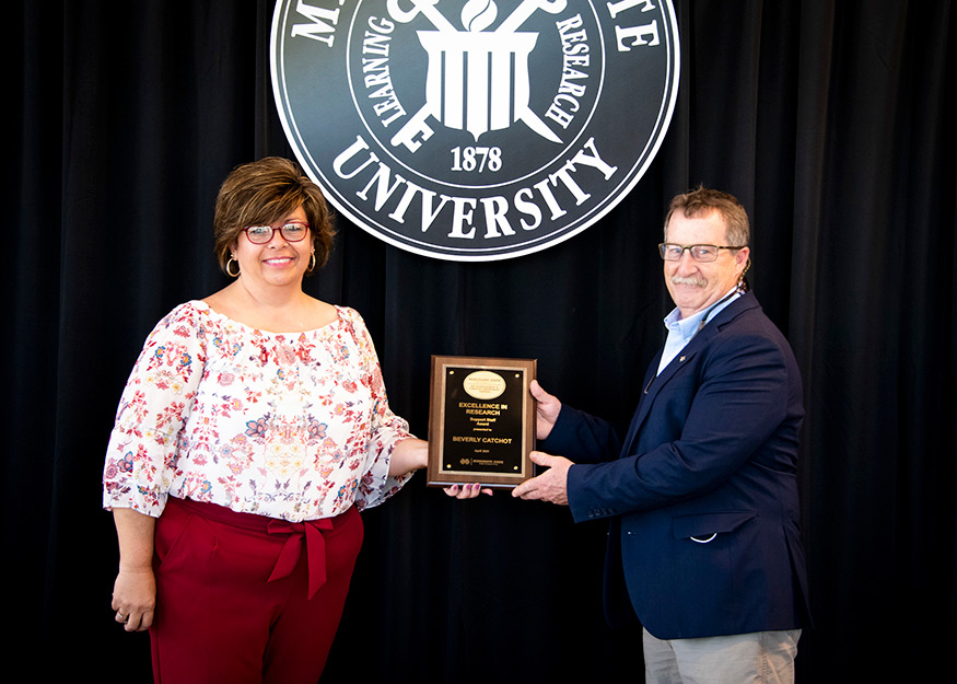 Beverly Catchot, MAFES Outstanding Research Staff Award winner, and Wes Burger (Photo by Dominique Belcher)