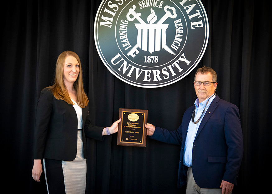 Amanda Stone, MAFES Outstanding Publication Award winner, and Wes Burger 