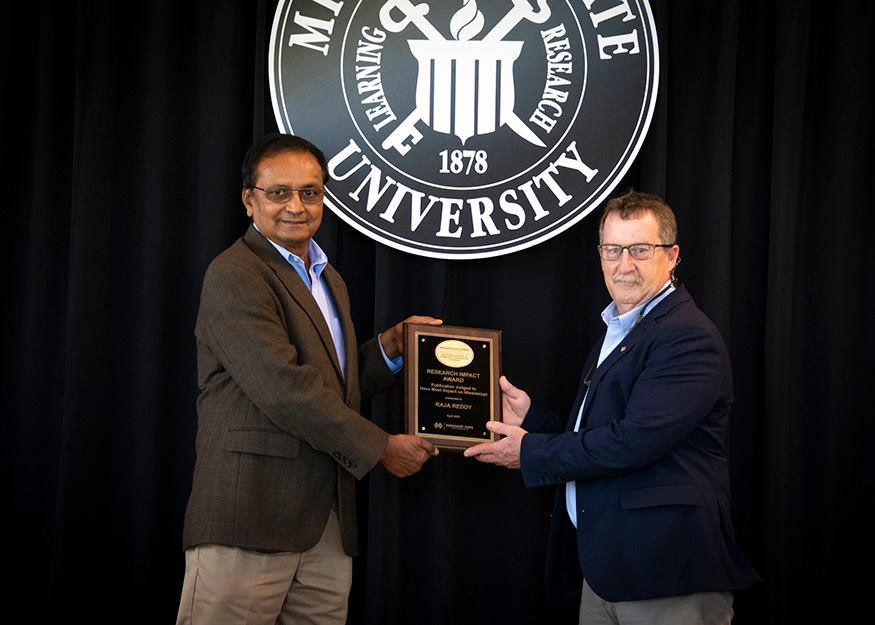 Raja Reddy, MAFES Most Impactful Publication Award winner, and Wes Burger (Photo by Dominique Belcher)