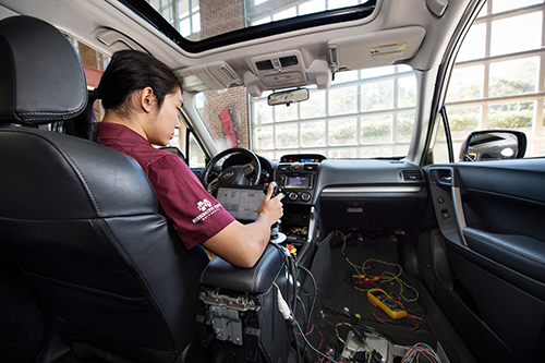 David Zhu, a senior mechanical engineering major from Clinton, is one of the Mississippi State University students working on the ‘Halo Project' supercar, an all-electric and self-driving sport utility vehicle. (Photo by Megan Bean)
