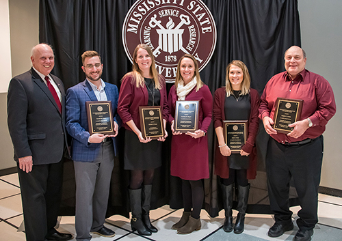 The College of Forest Resources dean is pictured with five award-winning faculty members