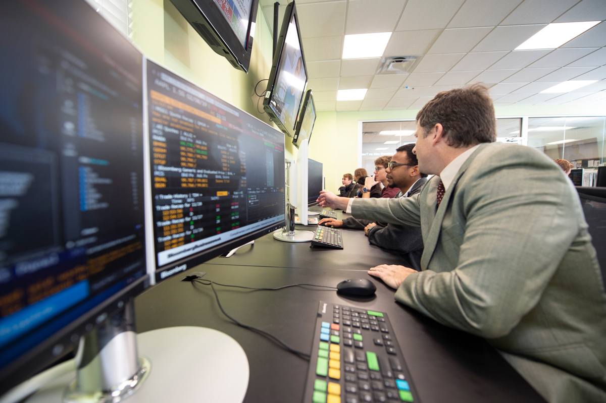 Gary Templeton assists a student in a College of Business computer lab.