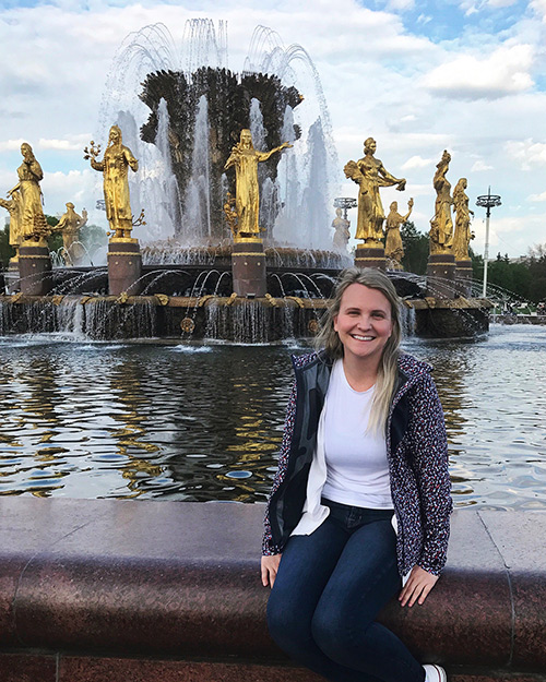 Christina E. Gusella smiles in front of the Friendship of Nations Fountain in Moscow. (Submitted photo) 