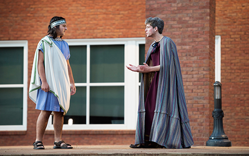 Two young men perform in a previous Greek and Roman play in Zacharias Village.