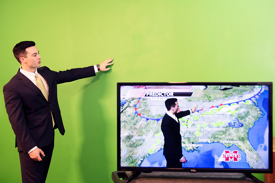 Dylan M. Federico, a 2018 MSU meteorology graduate from Metairie, Louisiana, is pictured in the university’s climate lab studio at Hilbun Hall. Federico is now employed as a meteorologist at WTVM in Columbus, Georgia. (Photo by Beth Wynn)