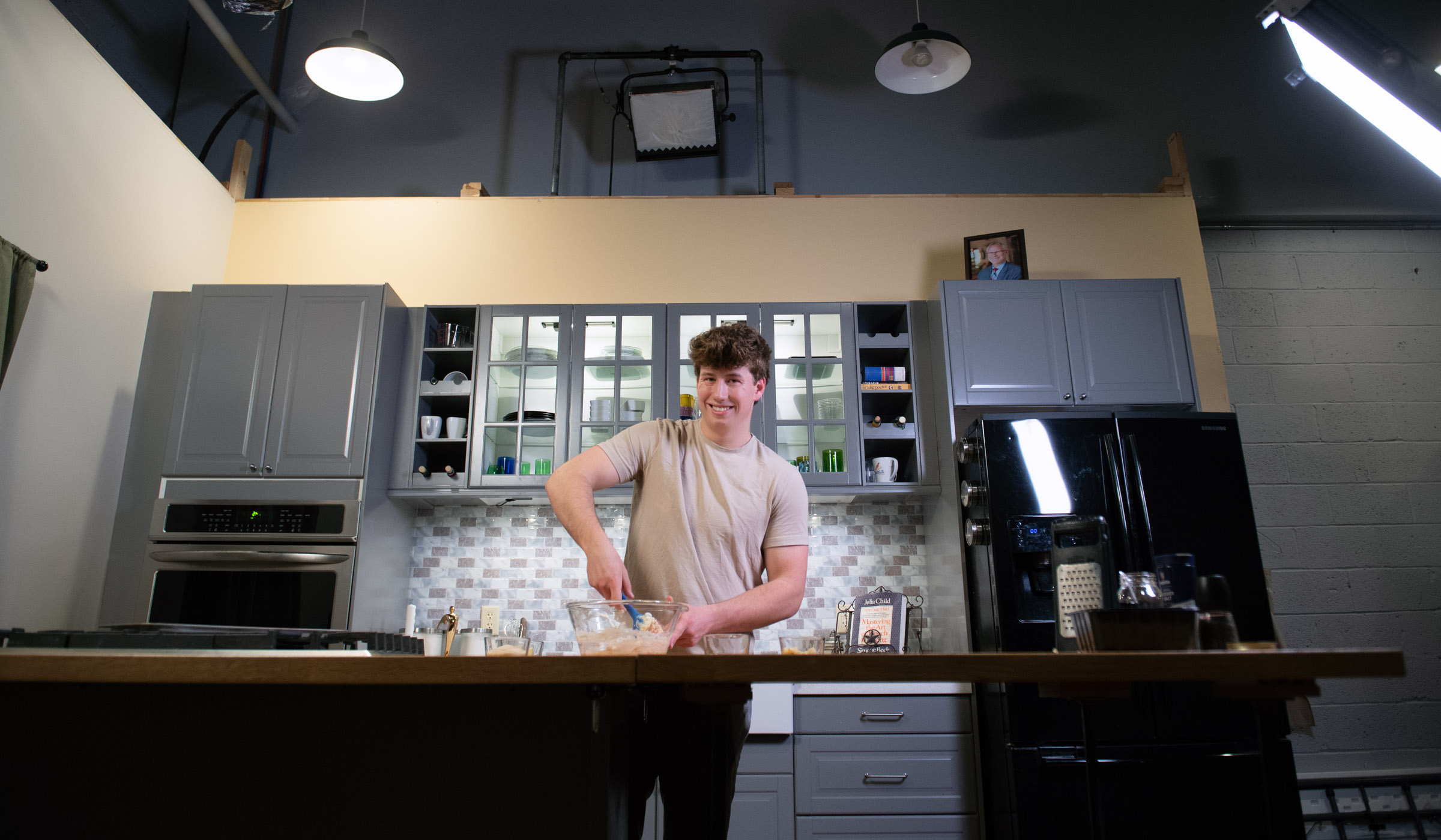 Mark Coblentz, pictured mixing together ingredients in a kitchen