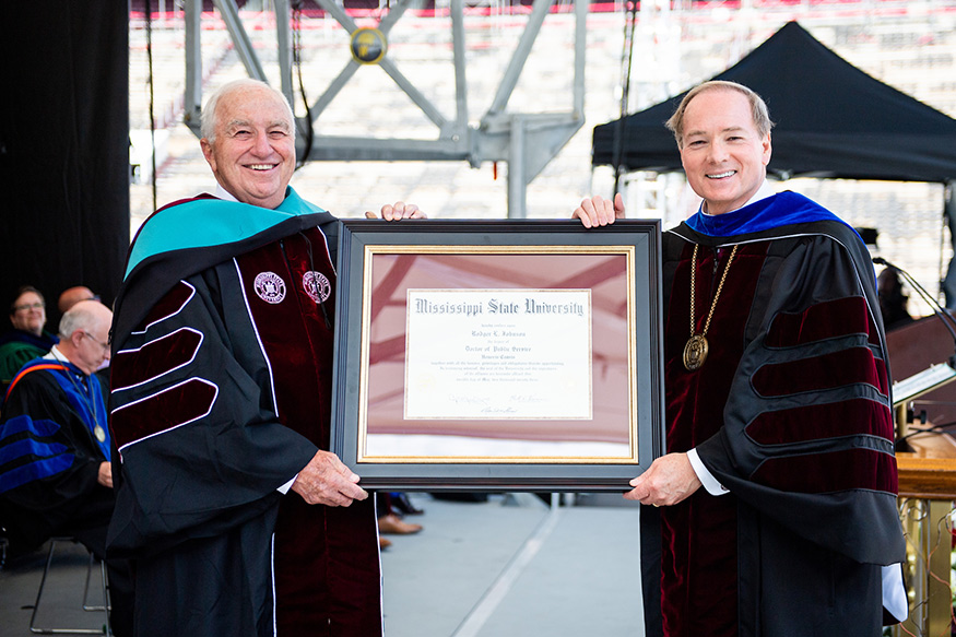 Mark Keenum presents Rodger L. Johnson wih an honorary degree