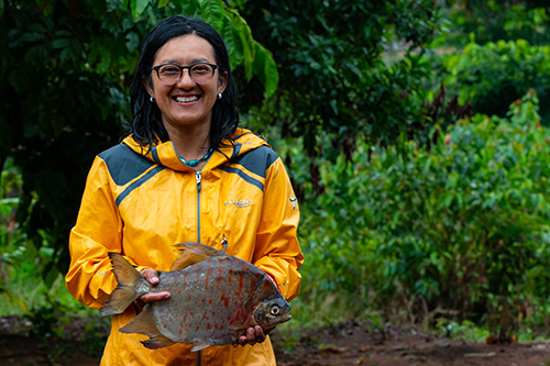 Photo of Sandra B. Correa holding a fish