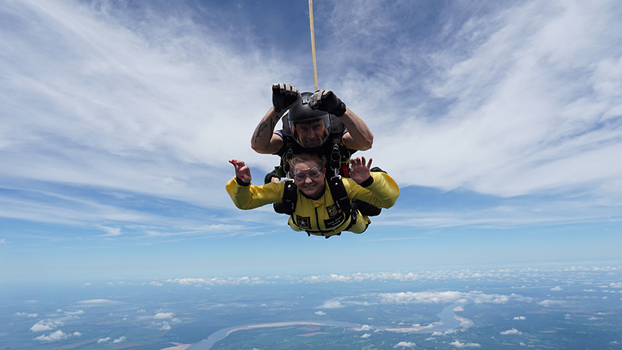 MSU Director of Admissions and Scholarships Lori Ball and a member of the U.S. Army’s Golden Knights mid-jump in skies over Memphis. 