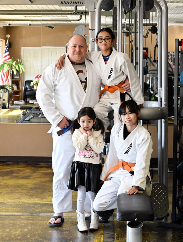 Cpl. Kody Biggs, a police officer with MSU-Meridian, is pictured with his daughters, Sailor, 11, Myj, 12 (seated) and Ono, 5. 