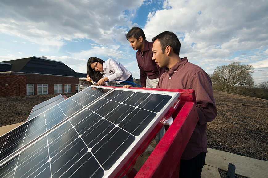 A team of Mississippi State students is developing technology to more cost-effectively desalinate seawater and brackish water, earning an Environmental Protection Agency grant for its efforts. The team is led by principal investigator Veera Gnaneswar Gude (center), an assistant professor of civil and environmental engineering in the Bagley College of Engineering, as well as graduate students Edith Martinez-Guerra (left) and Hugo Guerra (right). (Photo by Megan Bean)