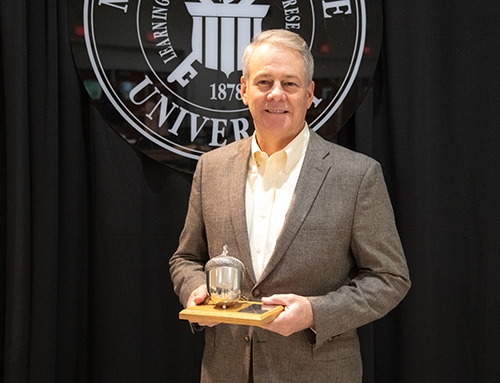 Steve Demarais holds a plaque commemorating his designation as Taylor Chair in Applied Big Game Research and Instruction at the recent College of Forest Resources/Forest and Wildlife Research Center Advisory Board luncheon and awards program. (Photo by David Ammon)