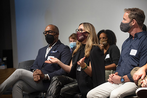 Jaime Rummerfield, center, of Woodson and Rummerfield interior design firm, answers a student question during the Design Leadership Foundation Workshop as other panelists Ron Woodson, left, and Mark Williams, right, look on. 