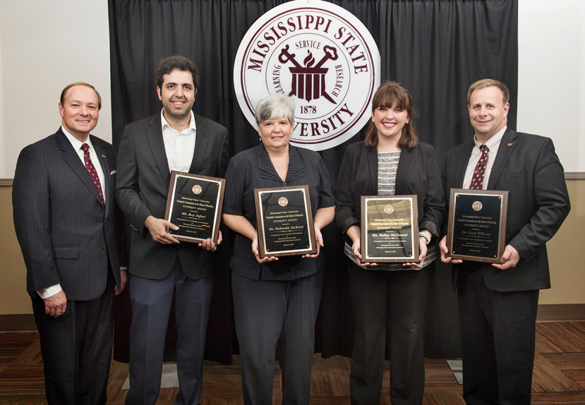 MSU President Mark E. Keenum (left) congratulates 2017 MSU Diversity Award winners, from left, Roy Jafari, a doctoral student in industrial and systems engineering; Deborah Jackson, assistant professor in the Department of Counseling, Educational Psychology and Foundations; Bailey McDaniel, a senior sociology student; and Scott Willard, associate dean of the College of Agriculture and Life Sciences.  (Photo by Megan Bean)