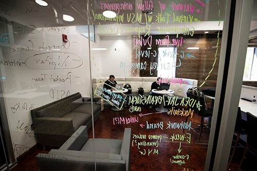 Writing on the glass walls of MSU's Center for Entrepreneurship and Outreach.