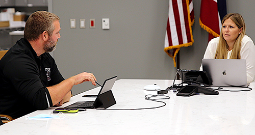 Reuben Burch and Courtney Taylor present during a virtual meeting