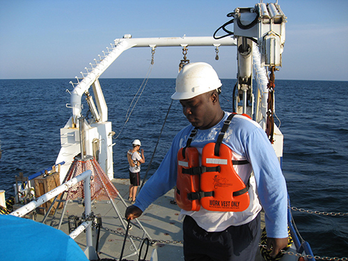 Ebenezer Nyadjro, an MSU associate research professor of oceanography through the Northern Gulf Institute, conducts research aboard a ship. 