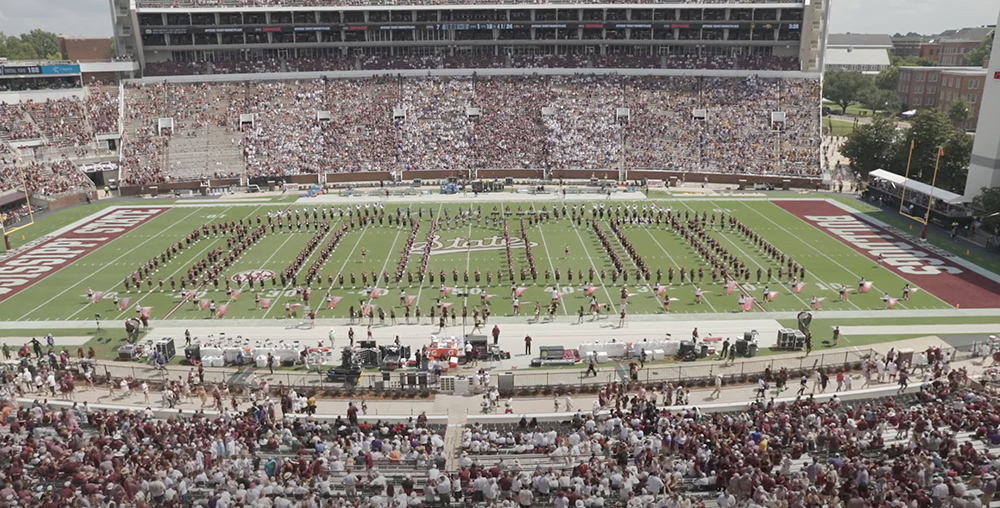 The Famous Maroon Band makes an outline of Humphrey Coliseum during a halftime show