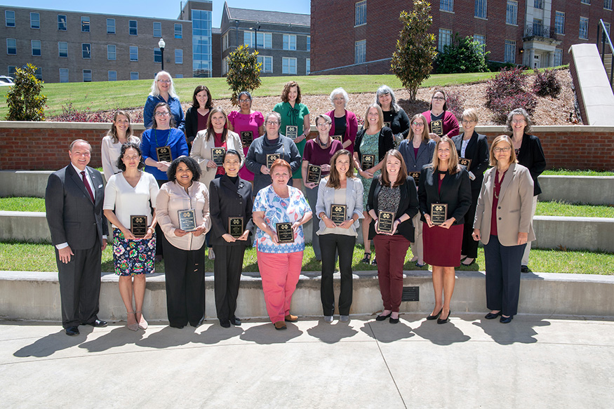 Mark and Julie Jordan stand with faculty that completed the MSU Spring Faculty Leadership Development Institute