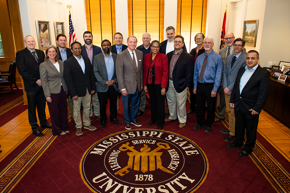 MSU President Mark E. Keenum, along with MSU Vice President for Research and Economic Development Julie Jordan, congratulate the 2023-24 MSU Faculty Leadership Program class, which included 19 faculty members from departments across campus. (Photo by Grace Cockrell)