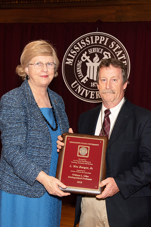 MSU Provost and Executive Vice President Judy Bonner congratulates L. Wes Burger Jr., a newly-designated William L. Giles Distinguished Professor. (Photo by Beth Wynn)