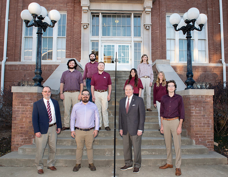 A group of SAF students pictured with their department head, faculty advisor and university president
