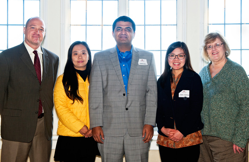 Interim Associate Vice President and Executive Director of MSU’s International Institute Jon Rezek (left) and Associate Vice President of Academic Affairs Julia Hodges (right) congratulate new Fulbright Scholars Xue Mei of China, Shahzaib Abbasi of Pakistan, and Hellen Stephanie of Indonesia.  (Photo by Beth Wynn)