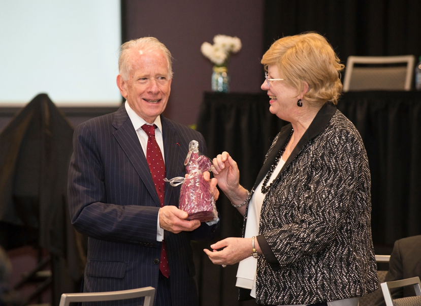 Mississippi State University Provost and Executive Vice President Judy Bonner (right) presents a cowbell to Allan Goodman, president of the Institute of International Education. Goodman was the keynote speaker during Friday’s [March 31] kick-off event for the Mississippi Chapter of the Fulbright Association. (Photo by Sarah Tewolde)