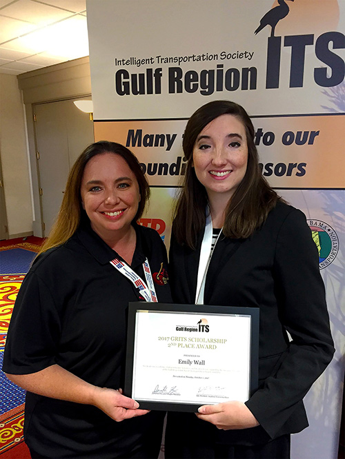 Diane Hammond (left), president of Gulf Region Intelligent Transportation Society, congratulates Emily Salmon-Wall (right) for her GRITS scholarship. (Photo submitted)
