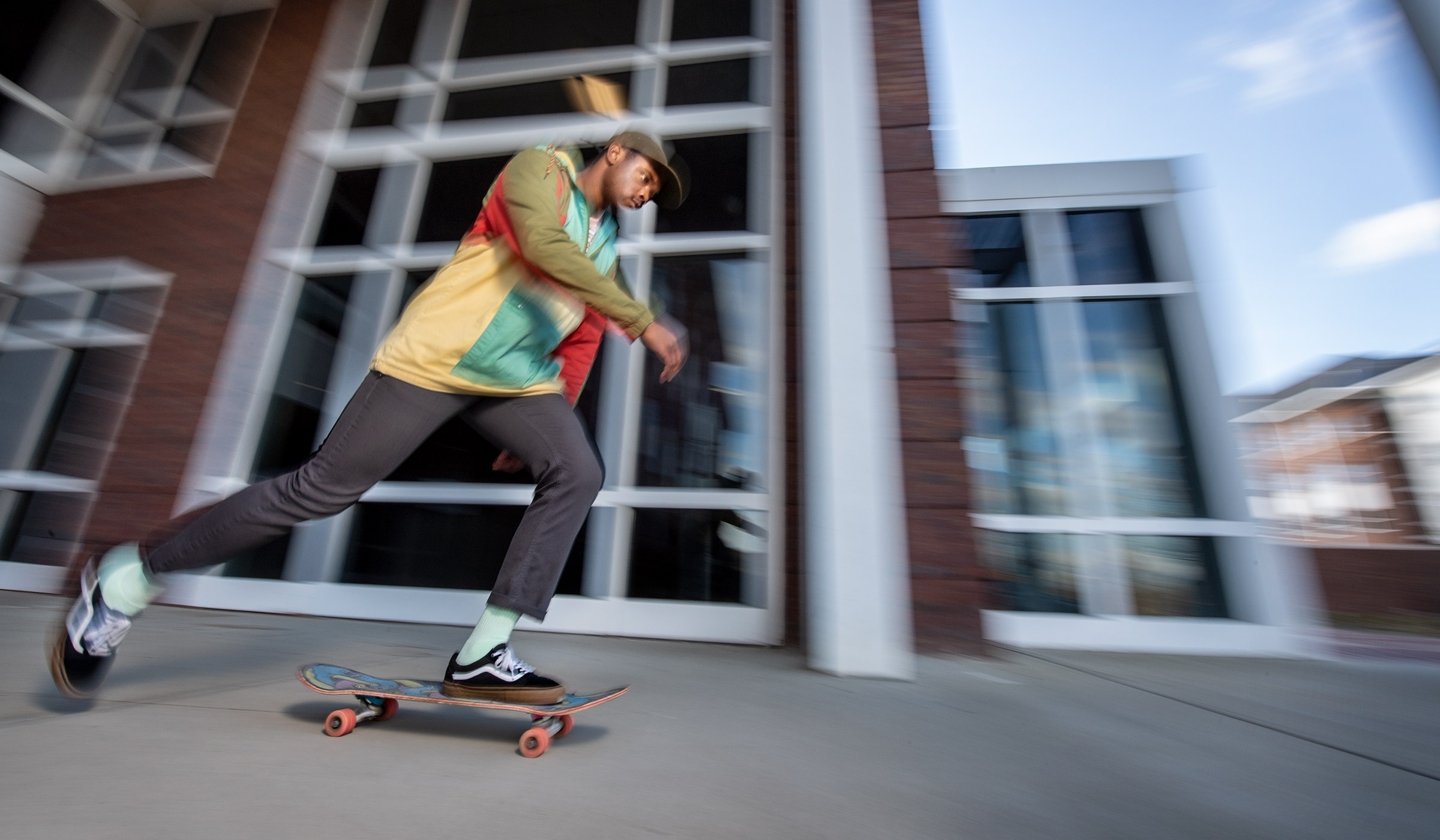 Patrick Games skateboards on the MSU campus.