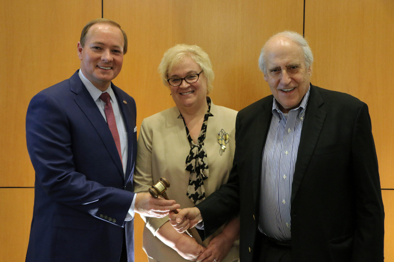 MSU President Mark E. Keenum, left, newly elected chair of the Foundation for Food and Agriculture Research board, accepts the gavel from Dan Glickman, outgoing FFAR board chair, former U.S. Secretary of Agriculture, and executive director of the Aspen Institute Congressional Program. Also congratulating Keenum is Sally Rockey, FFAR executive director. 