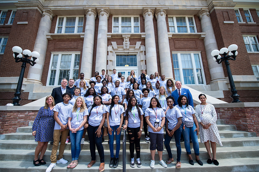 Students, teachers and organizers of the second AP physics preparatory academy at Mississippi State take a picture with MSU President Mark E. Keenum (second row, far right) on the steps of Lee Hall. (Photo by Logan Kirkland)