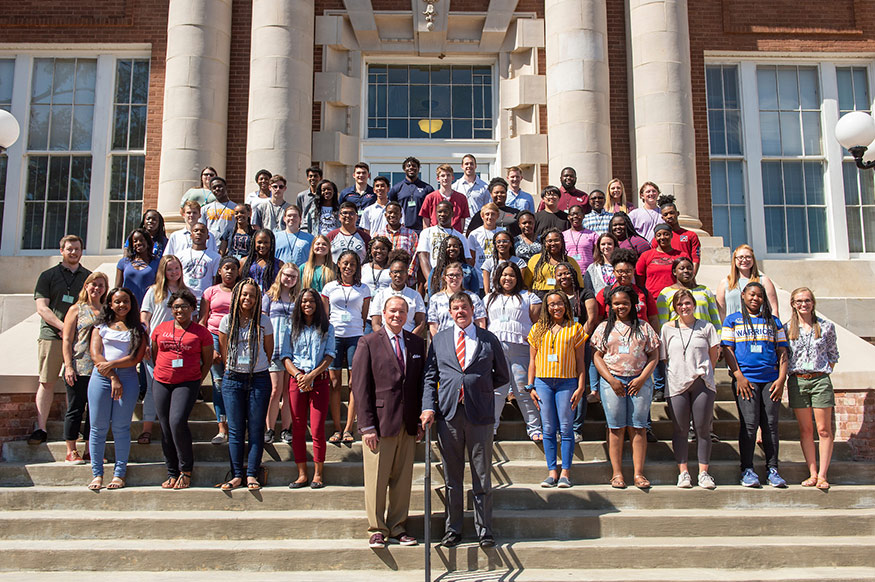 Students participating in a summer AP Physics preparatory academy at MSU from 13 Mississippi schools, along with teachers and other leaders, are pictured on the steps of historic Lee Hall with MSU President Mark E. Keenum and Bob Hearin of the Robert M. Hearin Foundation. The program is conducted by the Global Teaching Project and the Mississippi Public School Consortium for Educational Access. (Photo by Logan Kirkland)