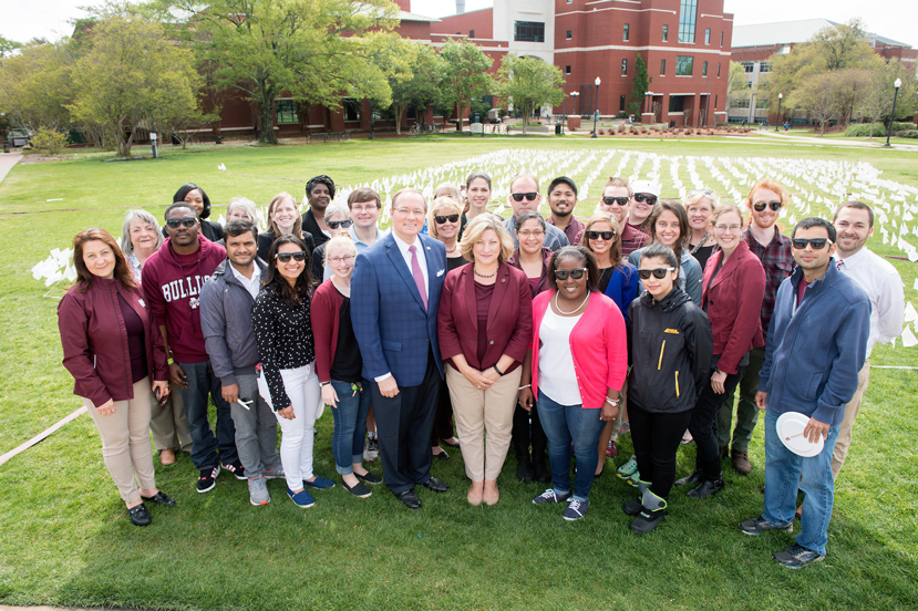 MSU President Mark E. Keenum and Graduate School Dean Lori Bruce (center) are pictured with students and staff during the April 3 kick-off event for Graduate Student Appreciation Week. (Photo by Beth Wynn)
