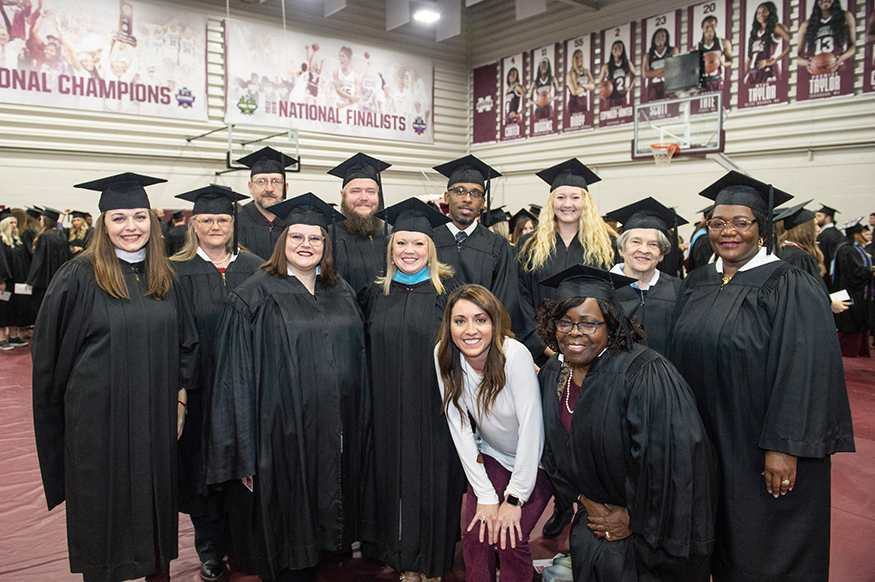 Mississippi IHL Project Coordinator Stephanie Bullock smiles for a group photo with fall 2019 MSU Complete 2 Compete graduates and C2C program leaders.