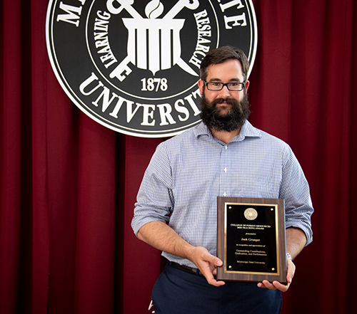 Joshua Granger holds the CFR/FWRC Teaching Award