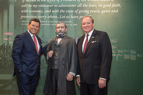 Bret Baier, author of the forthcoming book “To Rescue the Republic: Ulysses S. Grant, the Fragile Union, and the Crisis of 1876,” and MSU President Mark E. Keenum are pictured with one of the life-size statues of Ulysses S. Grant in the Grant Presidential Library, which is housed at Mississippi State’s Mitchell Memorial Library. 