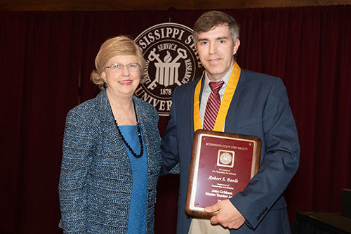 MSU Provost and Executive Vice President Judy Bonner congratulates Robert S. Banik, recipient of the John Grisham Master Teacher Award. (Photo by Beth Wynn)