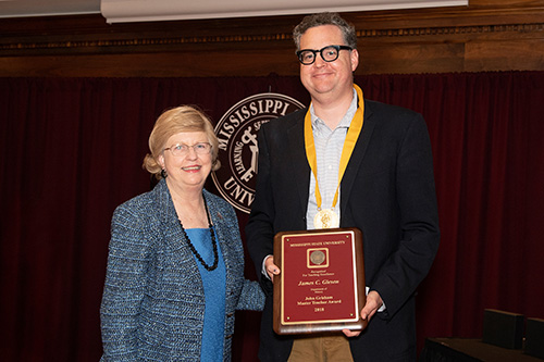 MSU Provost and Executive Vice President Judy Bonner congratulates James C. “Jim” Giesen, recipient of the John Grisham Master Teacher Award. (Photo by Beth Wynn)