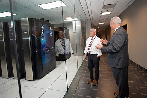 Roger Wicker and Trey Breckenridge look at MSU's Orion Supercomputer