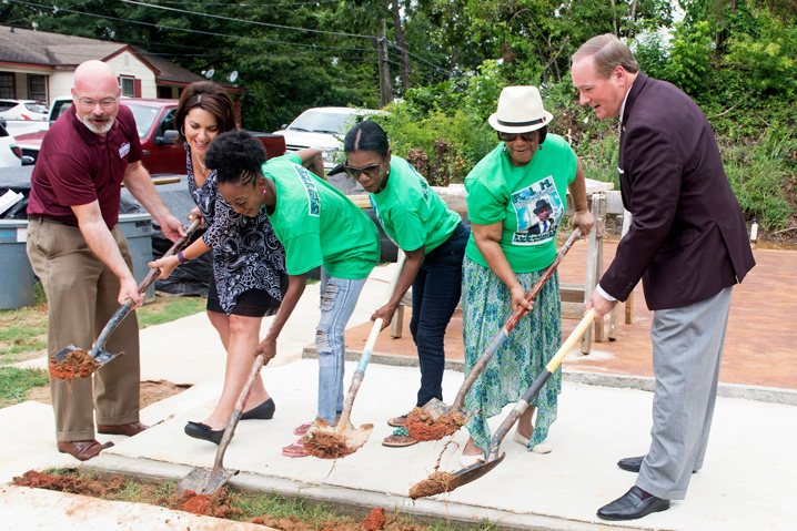 MSU and Starkville Area Habitat for Humanity officials broke ground Friday [Aug. 11] on the ninth Maroon Edition home. Pictured, left to right, are City of Starkville Community Development Director Buddy Sanders; Starkville Area Habitat for Humanity Board President Barbara Coats; Habitat partner Kareema Gillon; Gillon’s mother Vanessa Gillon; Gillon’s grandmother Corinne Shumpert; and MSU President Mark E. Keenum. (Photo by Beth Wynn)