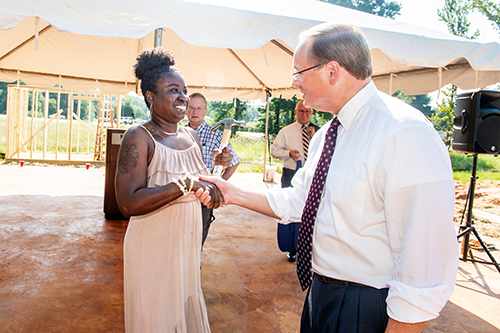 MSU President Mark E. Keenum shakes hands with Keyana Triplett