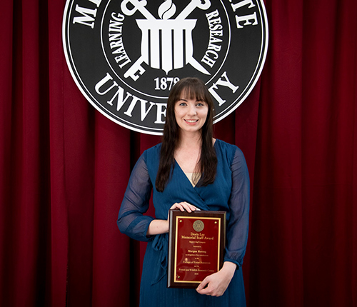 Morgan Herzog holds the CFR/FWRC Doris Lee Memorial Staff Award