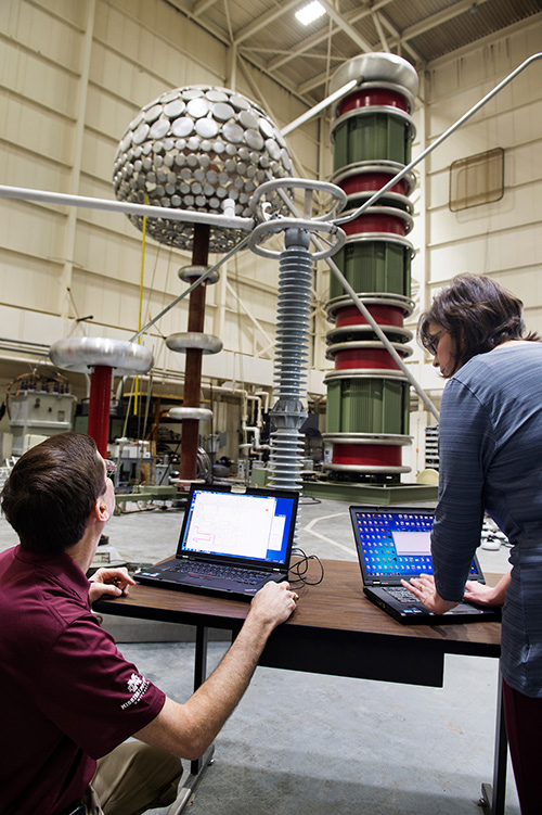 Researchers from Mississippi State’s Center for Advanced Vehicular Systems conduct work in the Paul B. Jacob High Voltage Laboratory. Support from Entergy Mississippi will provide for updates to the facility, which is utilized for academic research and education in high voltage engineering and to meet the evaluation needs of the industry. (Photo by Megan Bean)