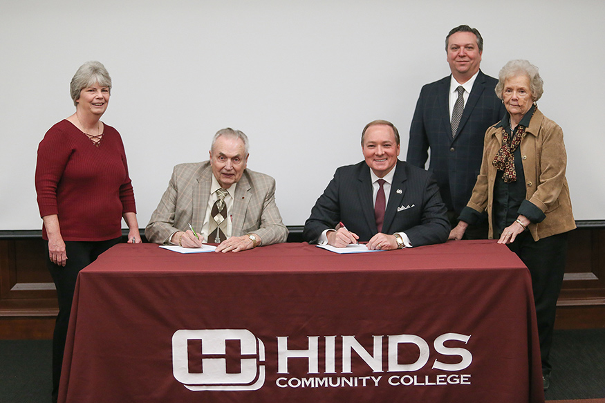 Hinds Community College President Clyde Muse, seated left, and Mississippi State University President Mark E. Keenum sign an agreement Wednesday [March 20] formalizing Hinds’ new membership with the Mississippi Library Partnership. Looking on are, standing from left, Hinds Community College District Dean of Libraries Mary Beth Applin, MSU Associate Dean of Libraries Stephen Cunetto, and MSU Dean of Libraries Frances Coleman. (Photo by April Garon)