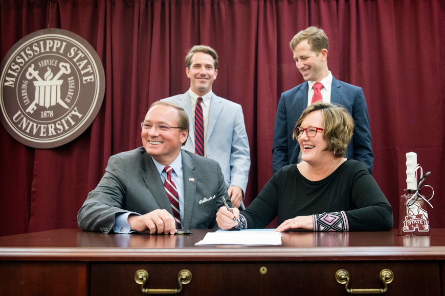 MSU President Mark E. Keenum officially accepts papers of legendary Mississippi newspaper columnist and Vicksburg native Orley Mason Hood Jr., who died in 2014. Making the donation are wife Mary Ann Hood, and two sons, Tucker and Hunter Hood. The papers are becoming part of the Mississippi Journalism Collection housed in Mitchell Memorial Library’s Special Collections Department – Manuscripts Division.  (Photo by Megan Bean)