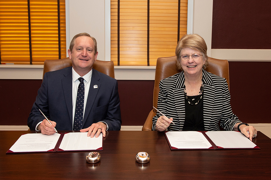 Itawamba Community College President Jay Allen, left, and Mississippi State Provost and Executive Vice President Judy Bonner sign a memorandum of understanding Friday [April 26] to create a pathway for ICC honors students to matriculate directly into the Judy and Bobby Shackouls Honors College at MSU. (Photo by Logan Kirkland)