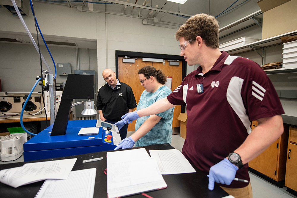ICET researchers test materials at the research center with Blue Delta Jean Co. CEO Josh West